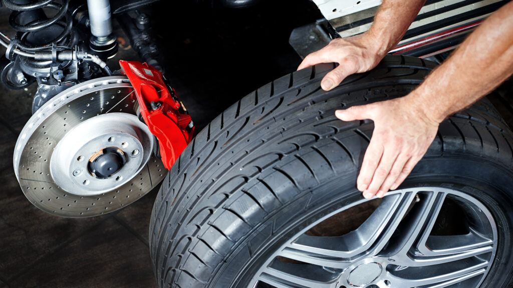 Changing A Tyre In A Garage