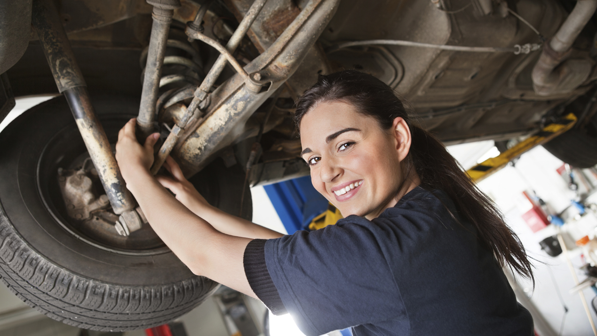 Portrait Of Smiling Young Female Mechanic