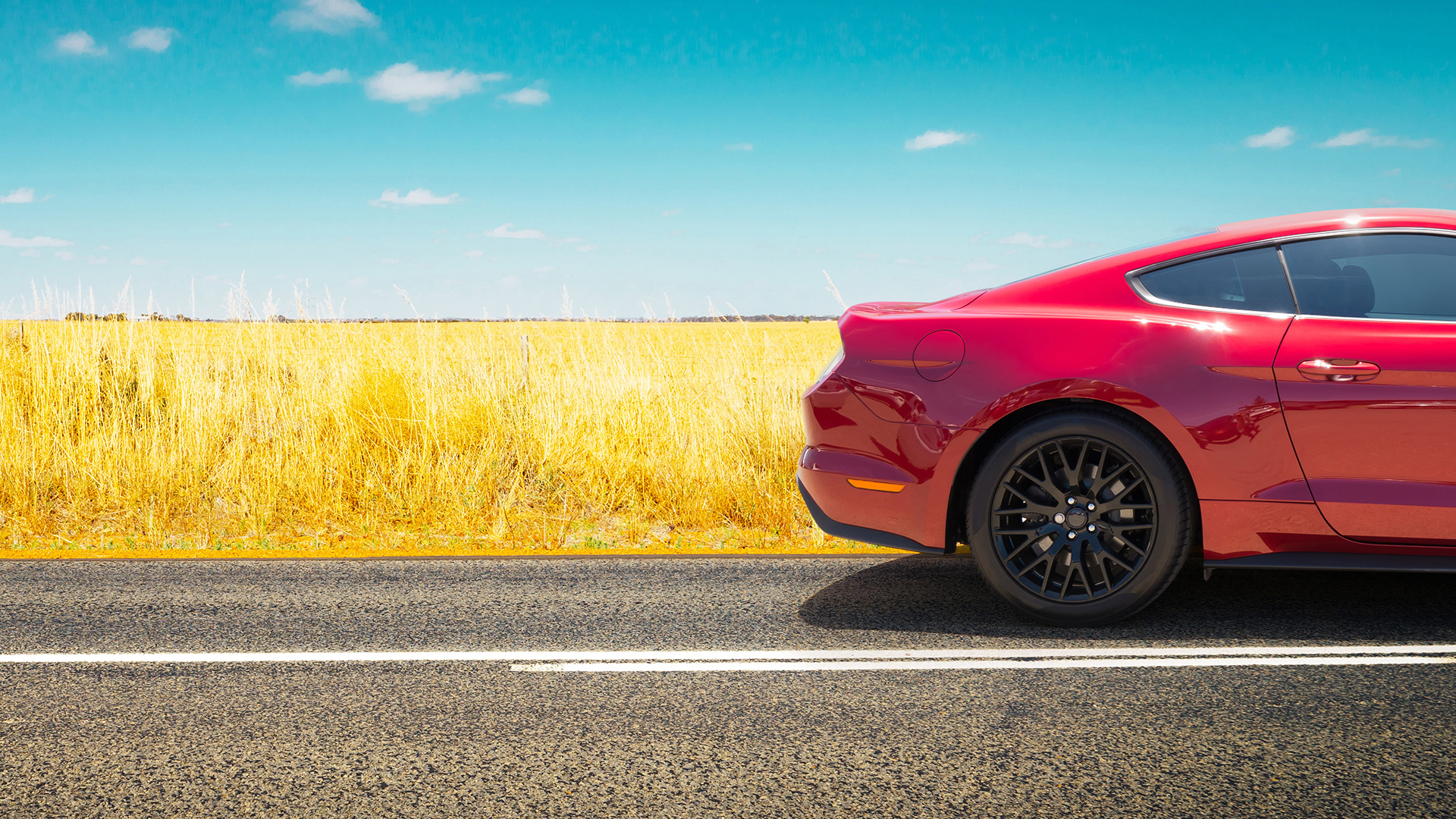 Sport Car .parked On Road Side With Field Of Golden Wheat Backgr